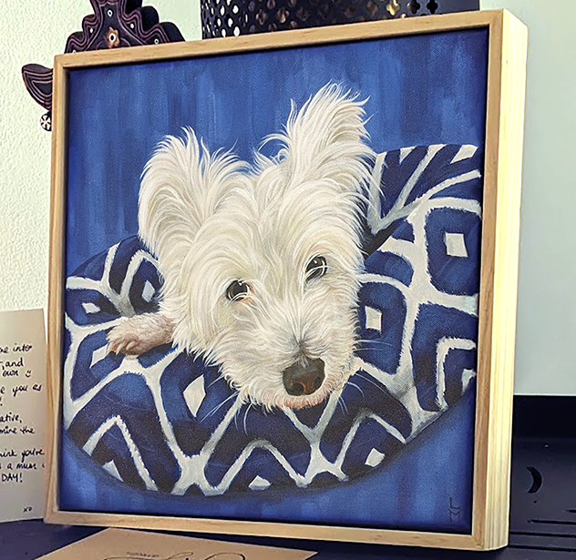 Framed artwork of a white dog on a blue patterned blanket custom pet portrait acrylic on canvas australia